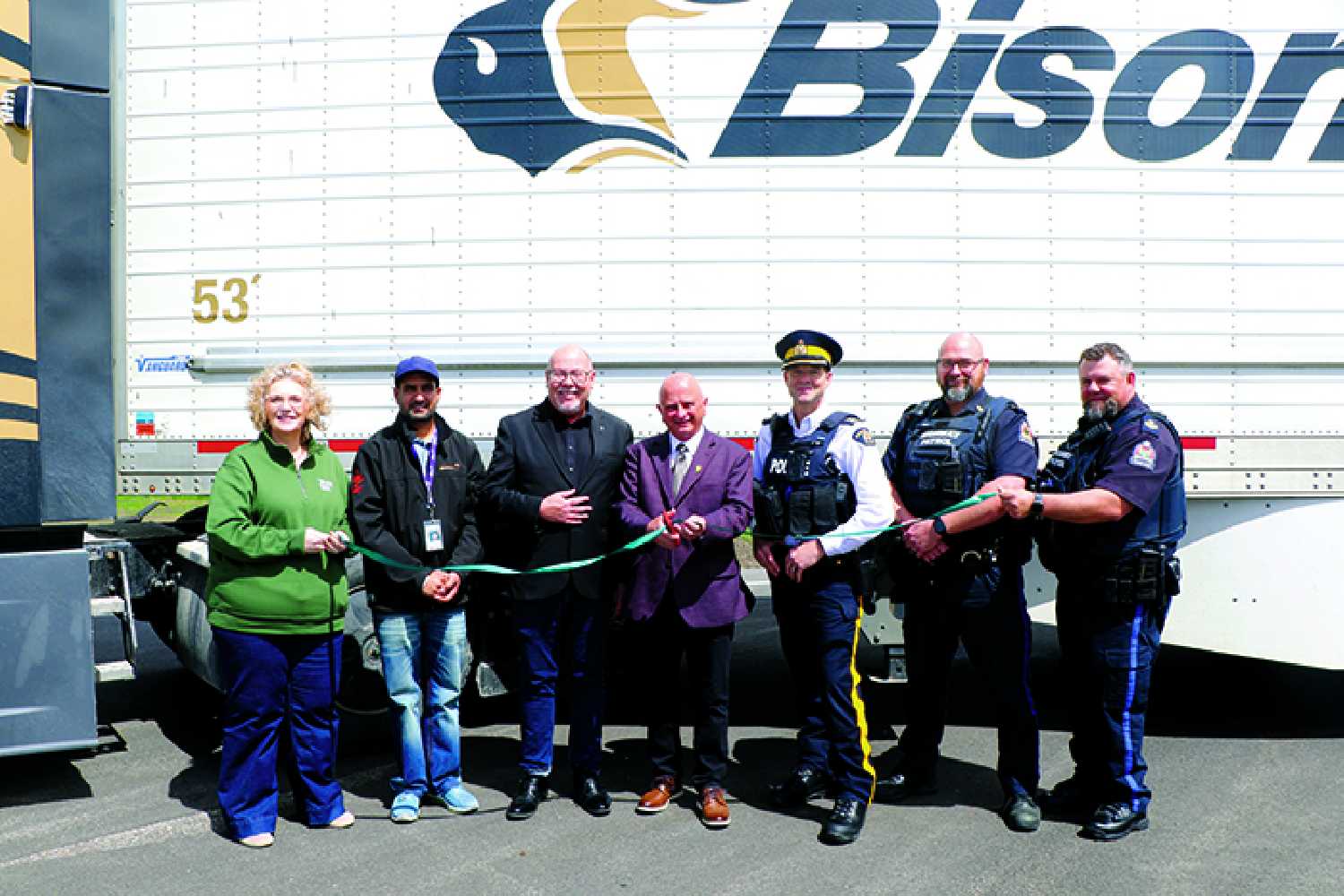 The official opening of the new truck pull out at the Moosomin weigh scale east of town on Friday.  Saskatchewan Highways Minister Kim Gartner (middle) cut the ribbon to officially open the new truck pullout.  He also highlighted highway construction in the Moosomin area and across southeast Saskatchewan.